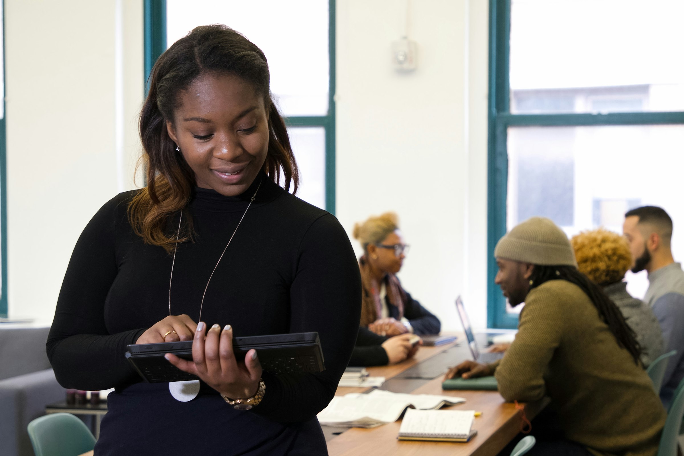 Trainer using a tablet in a training room